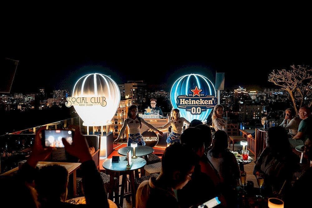 The outdoor stage features cutting-edge sound, where DJs and dancers set the Saigon night ablaze with energy and light (Source: Social Club Rooftop Bar)