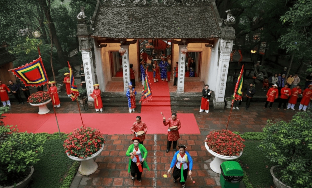 The festival comes alive with lion dances, water puppetry, and vibrant processions, offering visitors a rich cultural experience