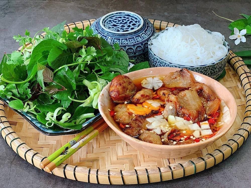 Bun cha Hanoi is usually paired with fried spring rolls