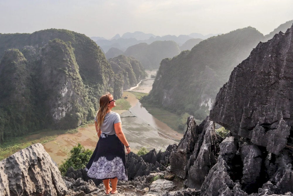 The stone stairway winds upward through cliffs and clouds, leading you to the breathtaking heights of Dragon Mountain Ninh Binh
