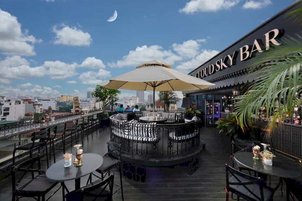 A lively bar with an energetic crowd and great city views