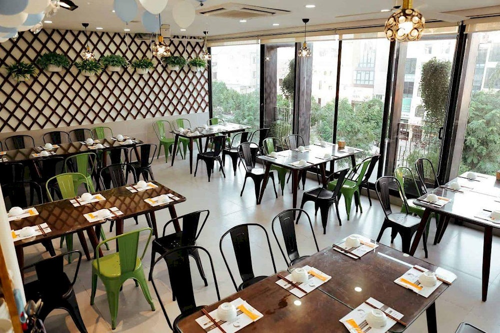 A greenery-filled setting makes Cha Ca Ha Thanh a refreshing escape for a relaxing meal in Hanoi 