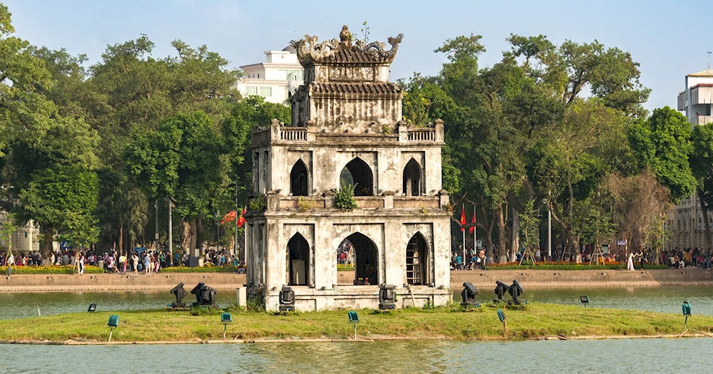 In the middle of the lake stands the ancient Turtle Tower, a symbol of history and legend