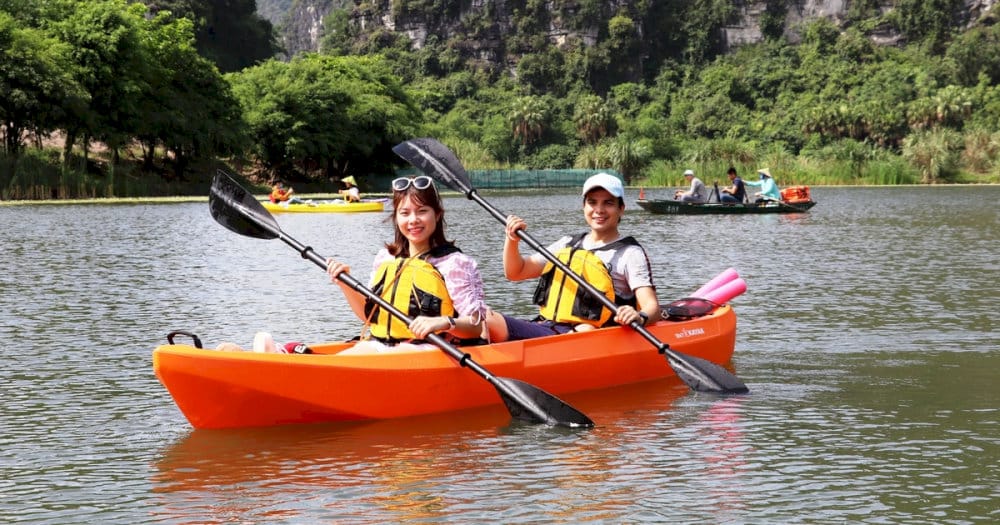 Kayaking on the calm, peaceful river is a one-of-a-kind experience in Trang An